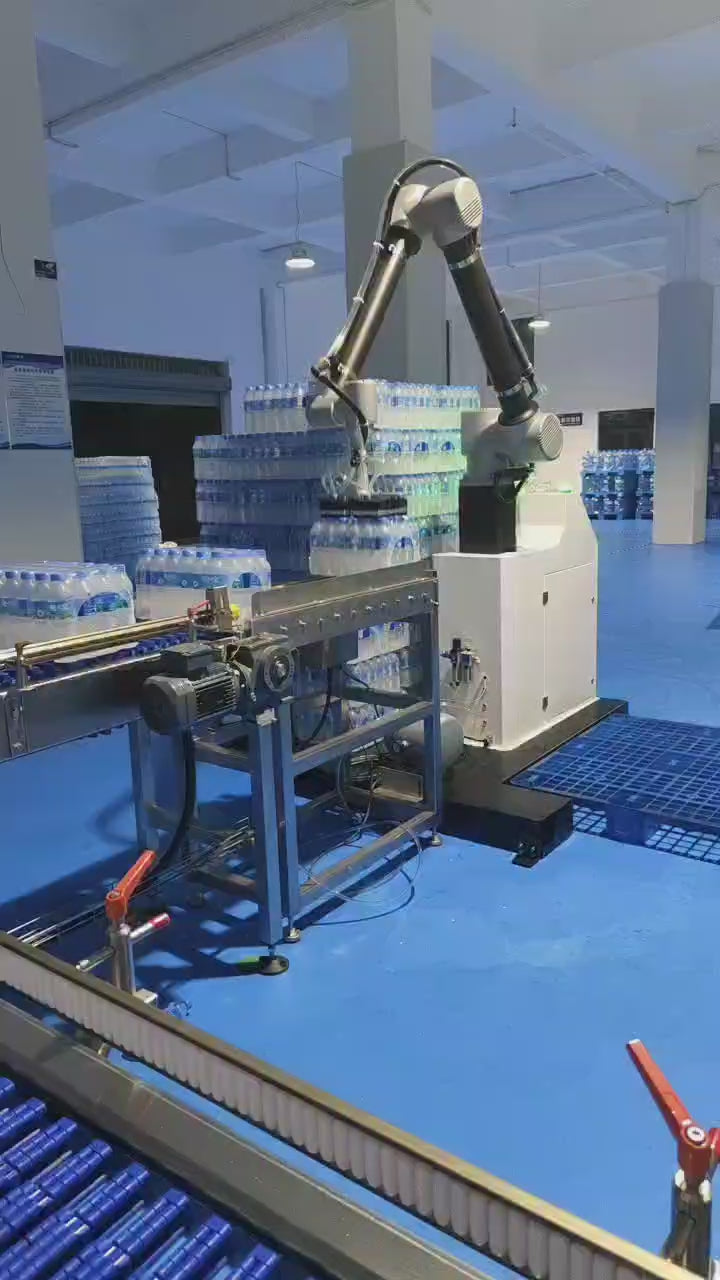 Automatic palletizer stacking bottled water cases on pallet with conveyor integration for food and beverage end-of-line packaging automation